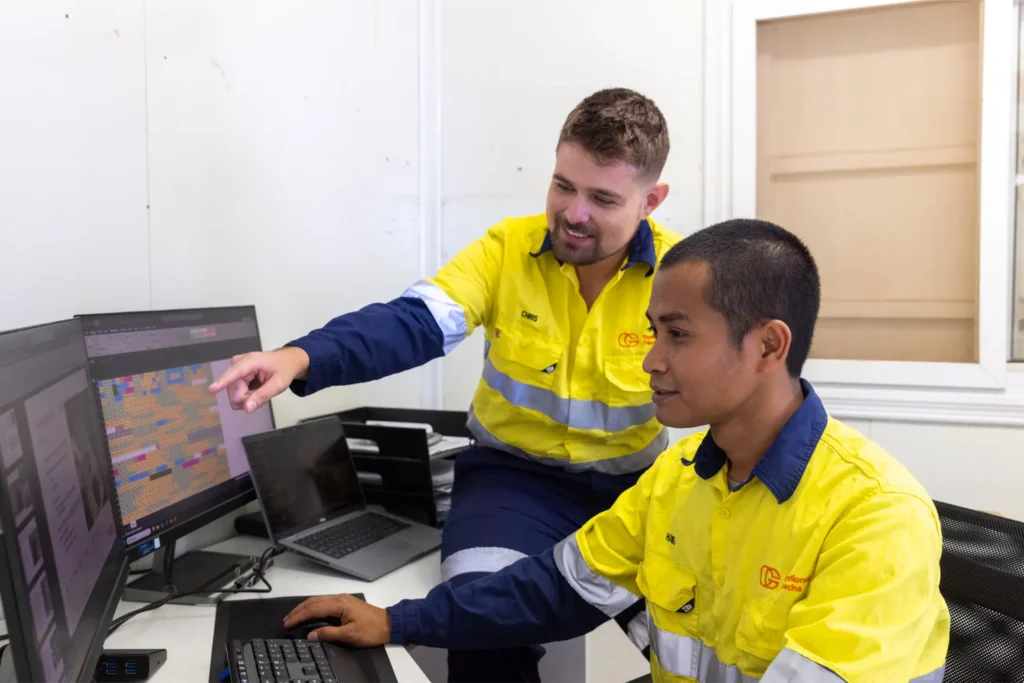 Operational Geotechs working at a computer